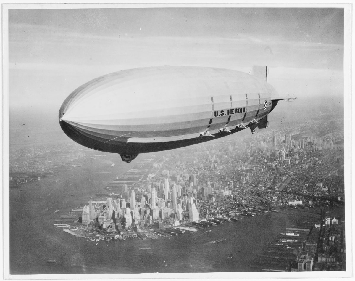 Off the California coast lies the sunken wreckage of the U.S. Navy's last flying aircraft carrier -- USS Macon (ZRS-5). The Macon served as a launch and takeoff platform for biplanes. FILE -- Flying over New York Harbor, circa Summer 1933. The southern end of Manhattan Island is visible in the lower left center. U.S. Naval History and Heritage Command Photograph.